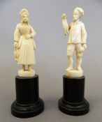 A pair of 19th century Dieppe carved ivory figures. Each 13 cm high including base.