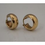 A pair of 9 ct gold hoop earrings. (2.