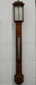 An Edwardian Negretti and Zambra inlaid mahogany stick barometer. 95 cm high.