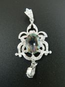 A silver and cubic zirconia pendant. 6 cm high.