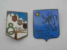 Two enamel badges