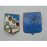 Two enamel badges