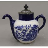 A Doulton Burslem Royals patent self-pouring Willow pattern teapot. 21.5 cm high.