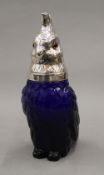 A blue glass parrot claret jug.