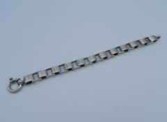 A silver bracelet.