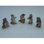 A small porcelain cat band. The largest 4.5 cm high.