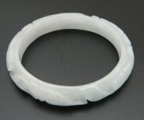 A white jade bangle. 7 cm diameter.