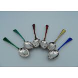 A set of six silver and enamel Cartier coffee spoons. 10 cm long (79.