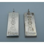 Two silver ingot form pendants. 3.5 cm high.