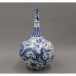 A large Chinese blue and white porcelain vase decorated with dragons. 39 cm high.