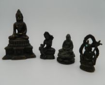 Four small bronze Buddha's. The largest 11 cm high.