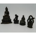 Four small bronze Buddha's. The largest 11 cm high.