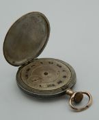 A niello cased pocket watch. 4 cm diameter.