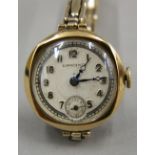 A vintage ladies 9 ct gold Eswang Swiss made watch on a 9 ct gold on silver bracelet. 2.