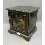 A small chinoiserie lacquered cabinet. 30 cm wide.