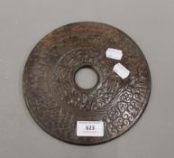 A Chinese carved jade bi disc. 20 cm diameter.