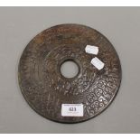 A Chinese carved jade bi disc. 20 cm diameter.