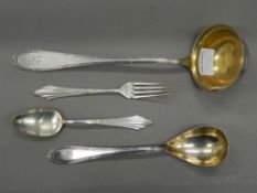 Four pieces of WMF cutlery. Ladle 30 cm long.