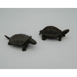 Two Japanese bronze models of tortoises. The largest 5.5 cm long.