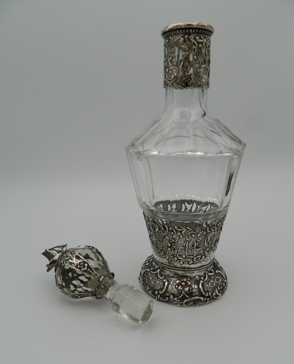 A Continental silver and cut glass decanter and stopper, the silver applied with figures, - Image 4 of 5