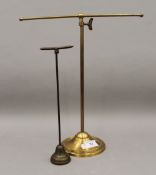 Two vintage brass shop display stands. The largest 36 cm high.