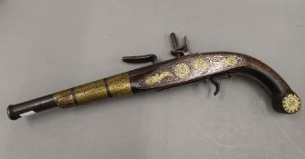 An Antique Eastern flintlock pistol. 41 cm long.