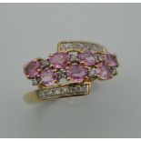 A 9 ct gold diamond and pink sapphire ring.