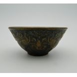A small bronze bowl decorated with elephants. 6 cm diameter.