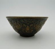 A small bronze bowl decorated with elephants. 6 cm diameter.
