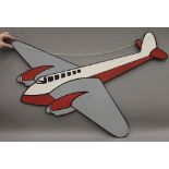 A painted wooden wall hanging formed as a vintage aeroplane. 97 cm wide.