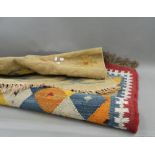 Two wool rugs. The smallest approximately 128 cm long.
