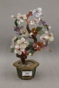 A Chinese miniature tree, made from various hardstone specimens. 28 cm high.