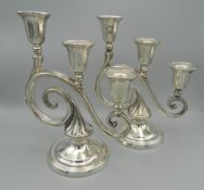 A pair of three branch sterling silver candlesticks. 22 cm high (25.6 troy ounces weighted).