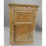 A 19th century pine hanging corner cupboard. 109 cm high.