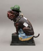 A cast iron money box formed as a dog. 21 cm high.