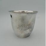 A Georg Jensen hand hammered sterling silver beaker, marks to base dated 1956. 8 cm high (4.