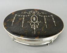 A large tortoiseshell mounted silver trinket box. 18.5 cm wide, 6 cm high.