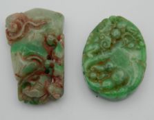 Two jade pendants. The largest 5.5 cm high.