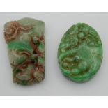 Two jade pendants. The largest 5.5 cm high.