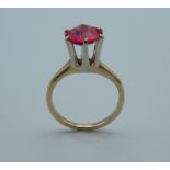 A 14 K yellow gold and solitaire ruby ring. Approximately 2.5 carats. Ring size L.