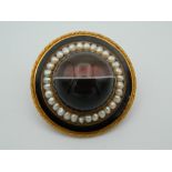 A Victorian unmarked gold, agate and pearl brooch, of target form,