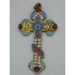 An enamelled decorated silver cross pendant, bearing Russian marks. 6 cm high.