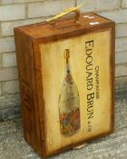 A wooden box painted with a champagne bottle.