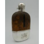 A sterling silver and glass spirit flask with reptile skin mounted optic. 14.5 cm high.