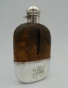 A sterling silver and glass spirit flask with reptile skin mounted optic. 14.5 cm high.