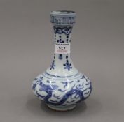 A Chinese blue and white porcelain vase decorated with dragons chasing flaming pearls,