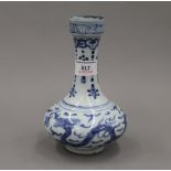 A Chinese blue and white porcelain vase decorated with dragons chasing flaming pearls,