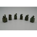 A set of six Chinese bronze seals, each set with an animal. The largest 4 cm high.