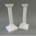 A pair of white porcelain Corinthian column candlesticks. 23 cm high.