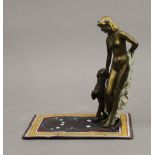 A cold painted bronze model of a girl and leopard